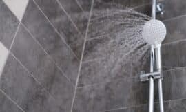 water running from a silver shower head