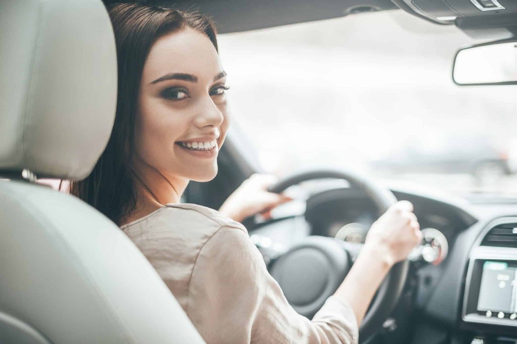 girl driving car after lasik
