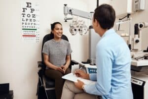 Eye doctor meeting with patient for refractive lens exchange